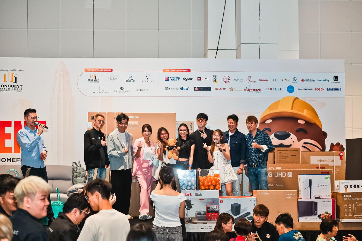 Celebrity ambassadors live on the HomeFest 1.0 stage with the prize wall